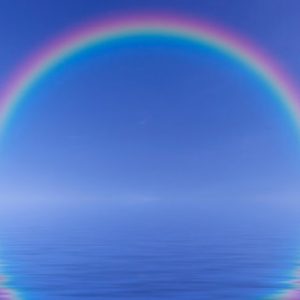 a rainbow on horizon auf sea